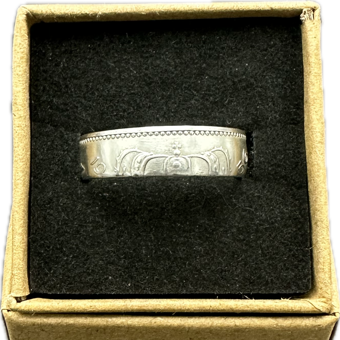Netherlands 1 Gulden Silver Coin Ring in brown kraft box on a black velvet background. - Mountainstruck Coin Jewelry
