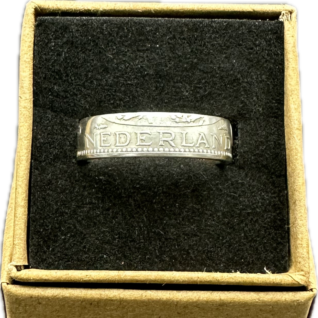 Netherlands 1 Gulden Silver Coin Ring in brown kraft box on a black velvet background. - Mountainstruck Coin Jewelry