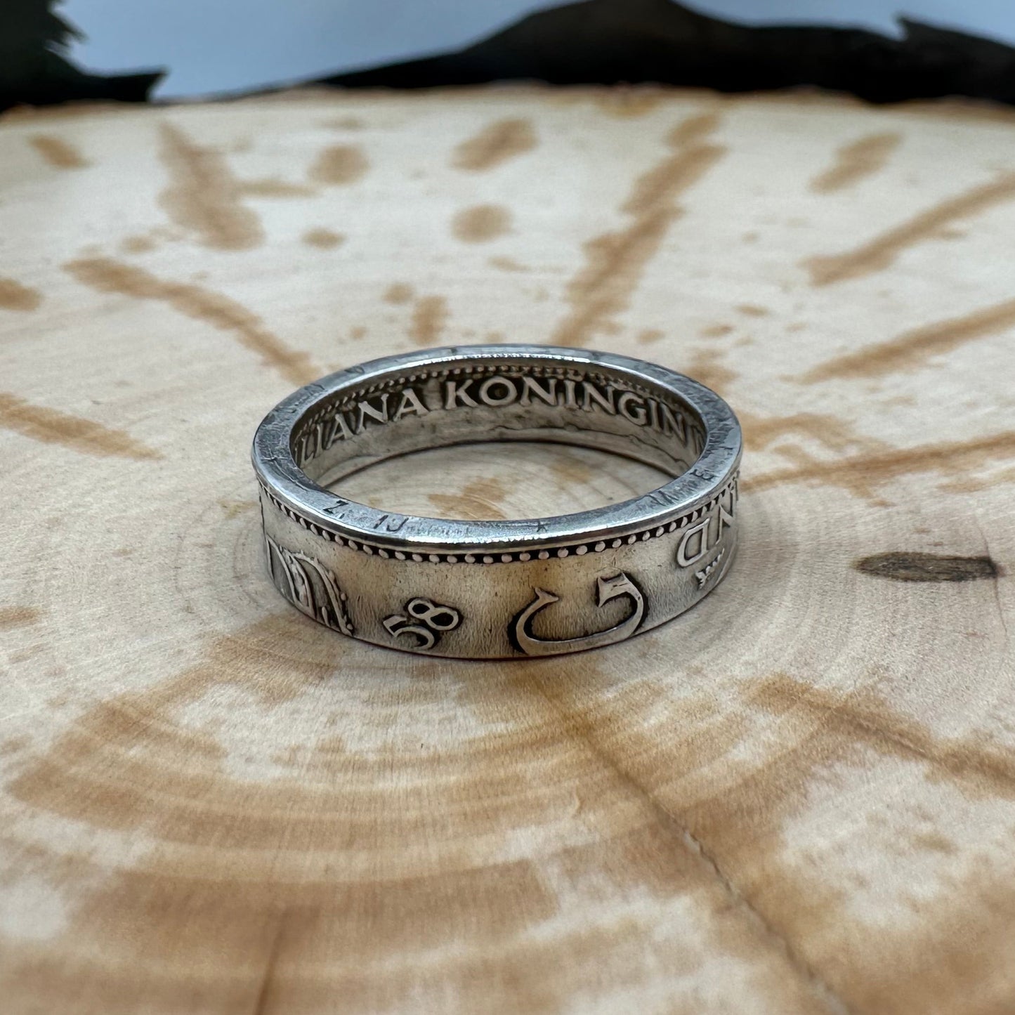 Netherlands 1 Gulden Silver Coin Ring on a wood background. - Mountainstruck Coin Jewelry