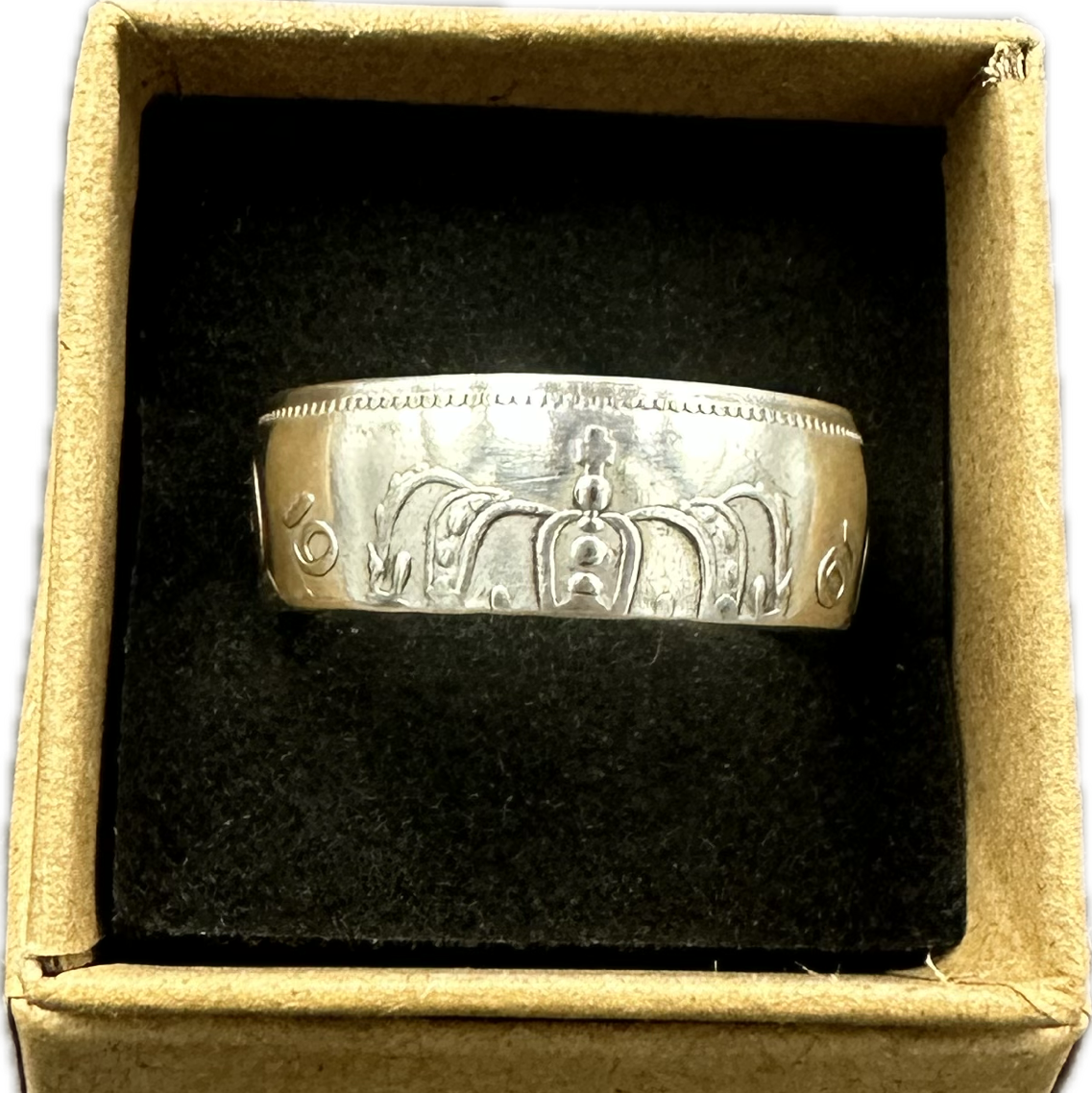 Netherlands 2.5 Gulden Silver Coin Ring in a brown kraft box on a black velvet background. - Mountainstruck Coin Jewelry