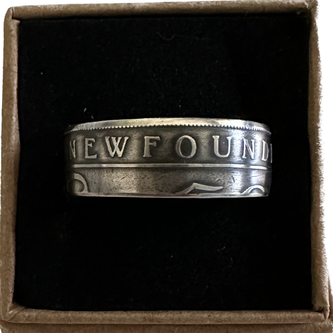 Newfoundland 50 Cents Silver Coin Ring in a brown kraft box on a black velvet background. - Mountainstruck Coin Jewelry