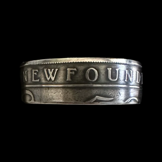 Newfoundland 50 Cents Silver Coin Ring in a brown kraft box on a black velvet background. - Mountainstruck Coin Jewelry