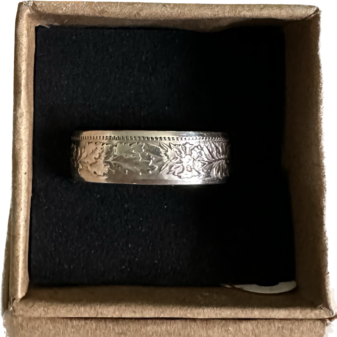 Swiss 2 Franc Silver Coin Ring (shine) in a brown kraft box on a black velvet background. - Mountainstruck Coin Jewelry