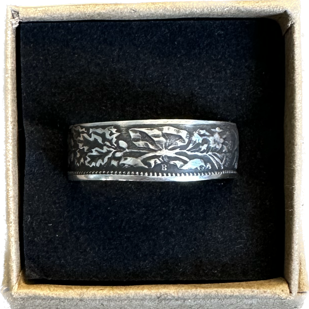 Swiss 2 Franc Silver Coin Ring (patina) in a brown kraft box on a black velvet background. - Mountainstruck Coin Jewelry