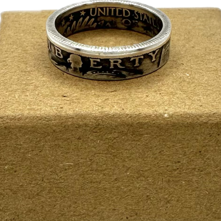 U.S. Standing Liberty Quarter Silver Coin Ring on a brown kraft box. - Mountainstruck Coin Jewelry