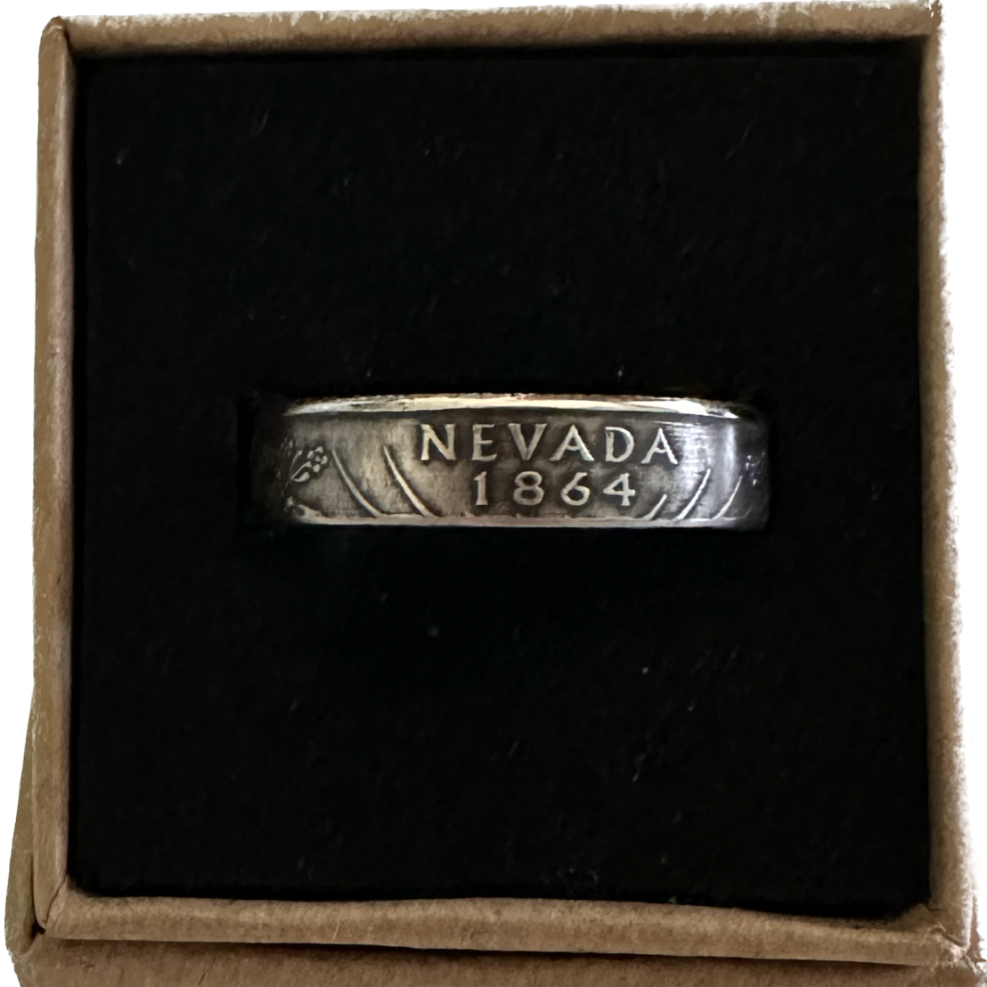 U.S. State Quarter Silver Coin Ring
featuring Nevada in a brown kraft box on a black velvet background. - Mountainstruck Coin Jewelry