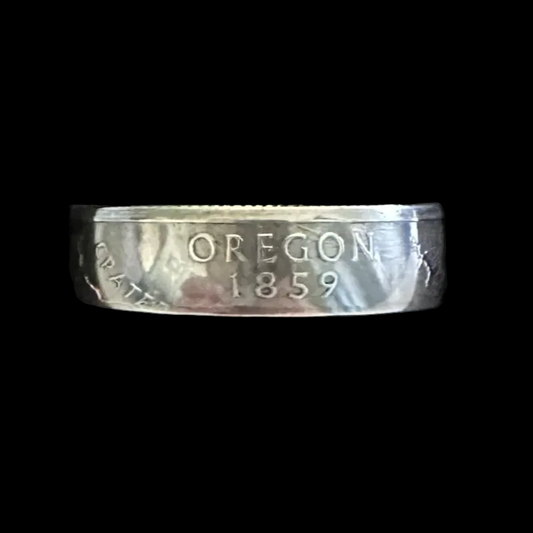 U.S. State Quarter Silver Coin Ring featuring Oregon in a brown kraft box on a black velvet background. - Mountainstruck Coin Jewelry