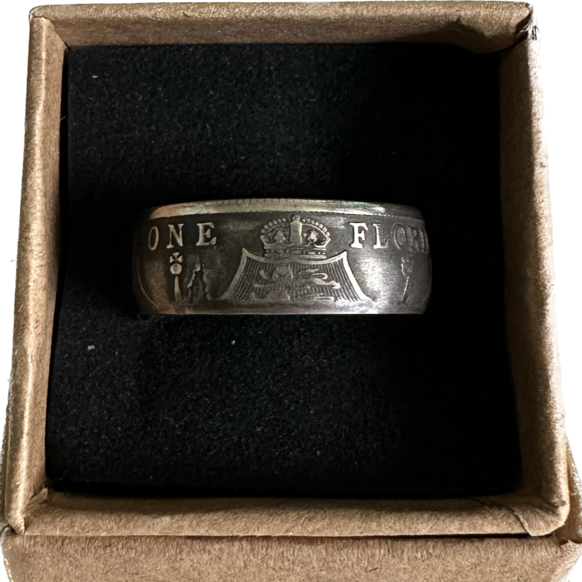 UK One Florin Silver Coin Ring in a brown kraft box on a black velvet background. - Mountainstruck Coin Jewelry