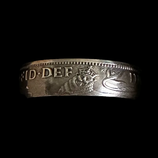 UK One Shilling Silver Coin Ring (shine) in a brown kraft box on a black velvet background. - Mountainstruck Coin Jewelry
