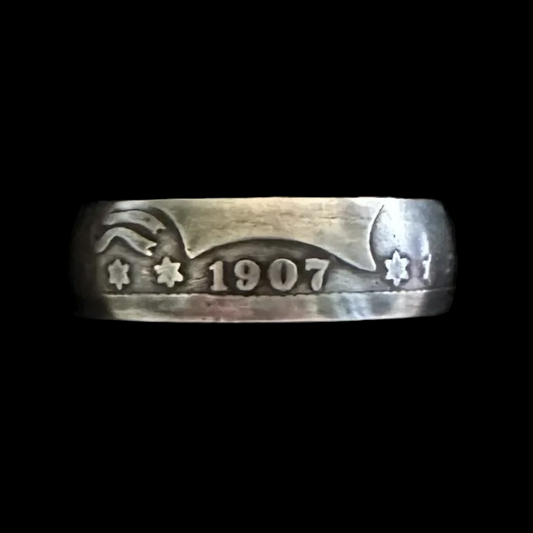U.S. Barber Silver Quarter Coin Ring (front) on a black velvet background in a brown kraft box.
- Mountainstruck Coin Jewelry