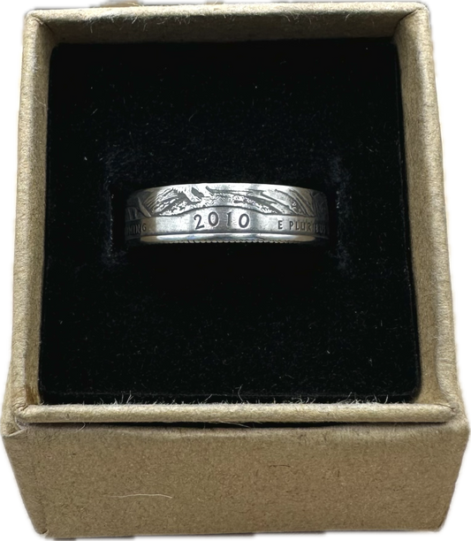 U.S. Yellowstone Quarter Coin Ring in a brown kraft box on a black velvet background. - Mountainstruck Coin Jewelry