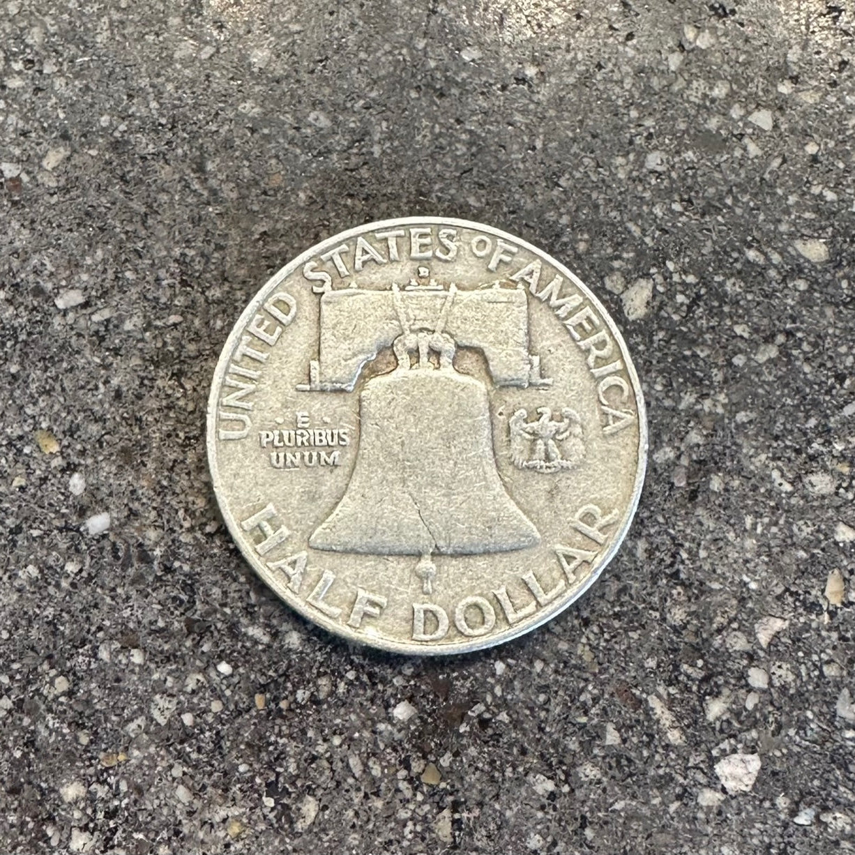 U.S. Ben Franklin Half Dollar Silver Coin (back) on a concrete background. - Mountainstruck Coin Jewelry