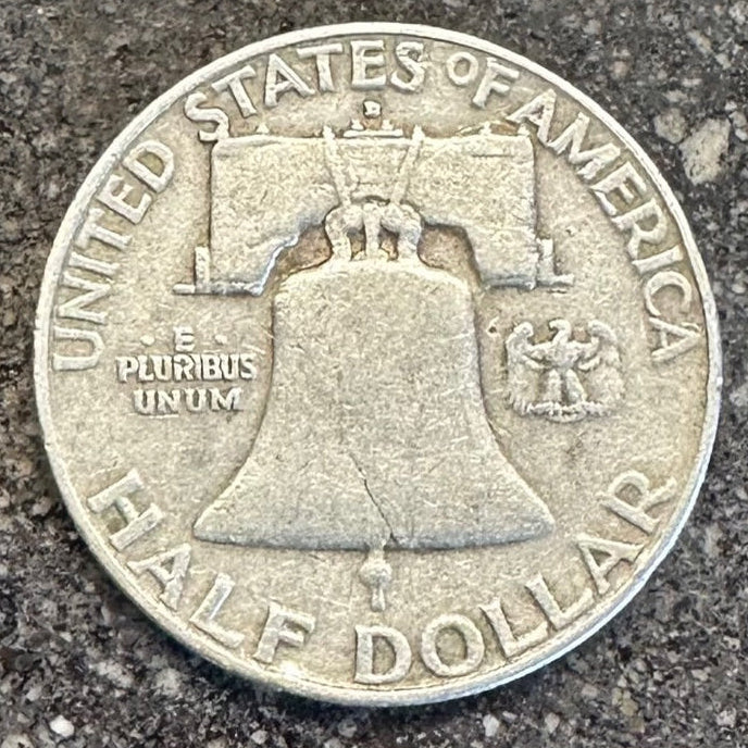 U.S. Ben Franklin Half Dollar Silver Coin (back) on a concrete background. - Mountainstruck Coin Jewelry