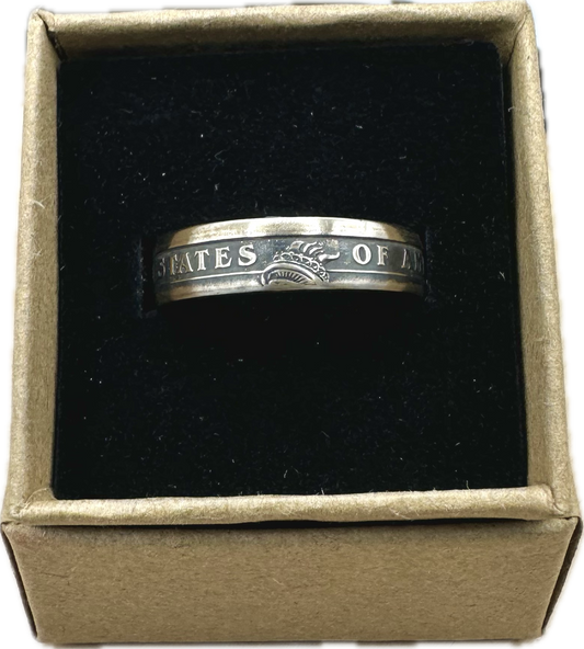 U.S. Presidential Dollar Coin Ring (Reverse) patina in a brown kraft box on a black velvet background. - Mountainstruck Coin Jewelry