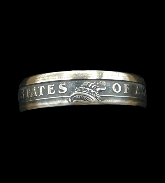 U.S. Presidential Dollar Coin Ring (Reverse) patina in a brown kraft box on a black velvet background. - Mountainstruck Coin Jewelry