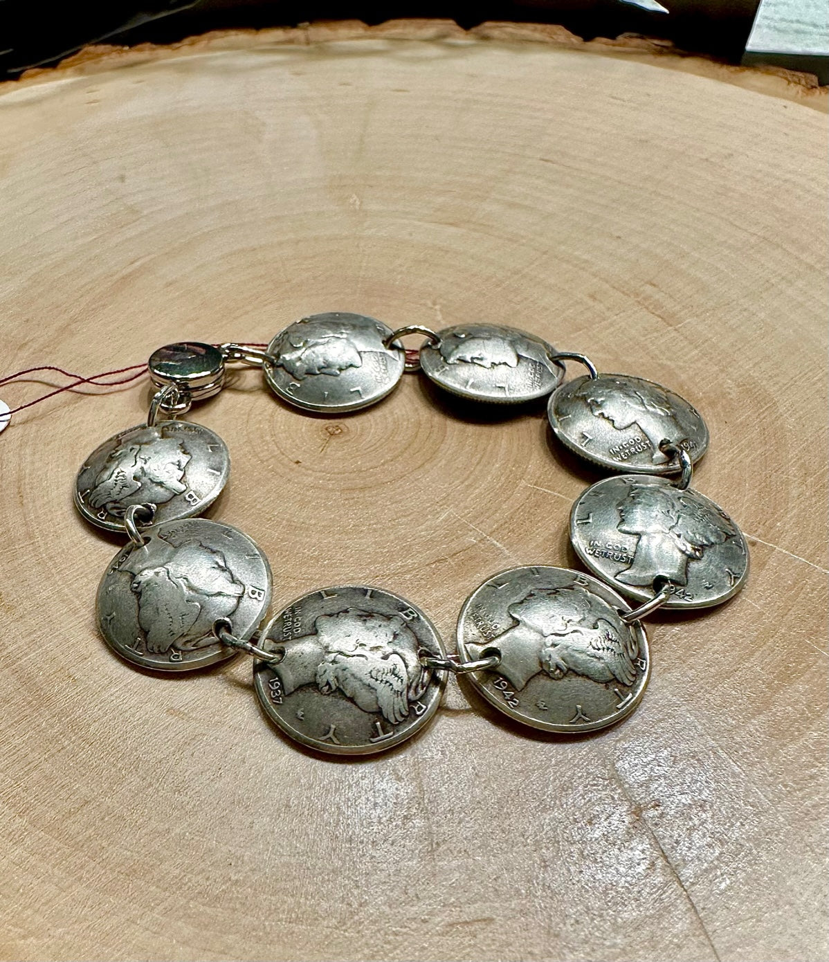 Mercury Silver Dime Coin Bracelet on a light wood round.