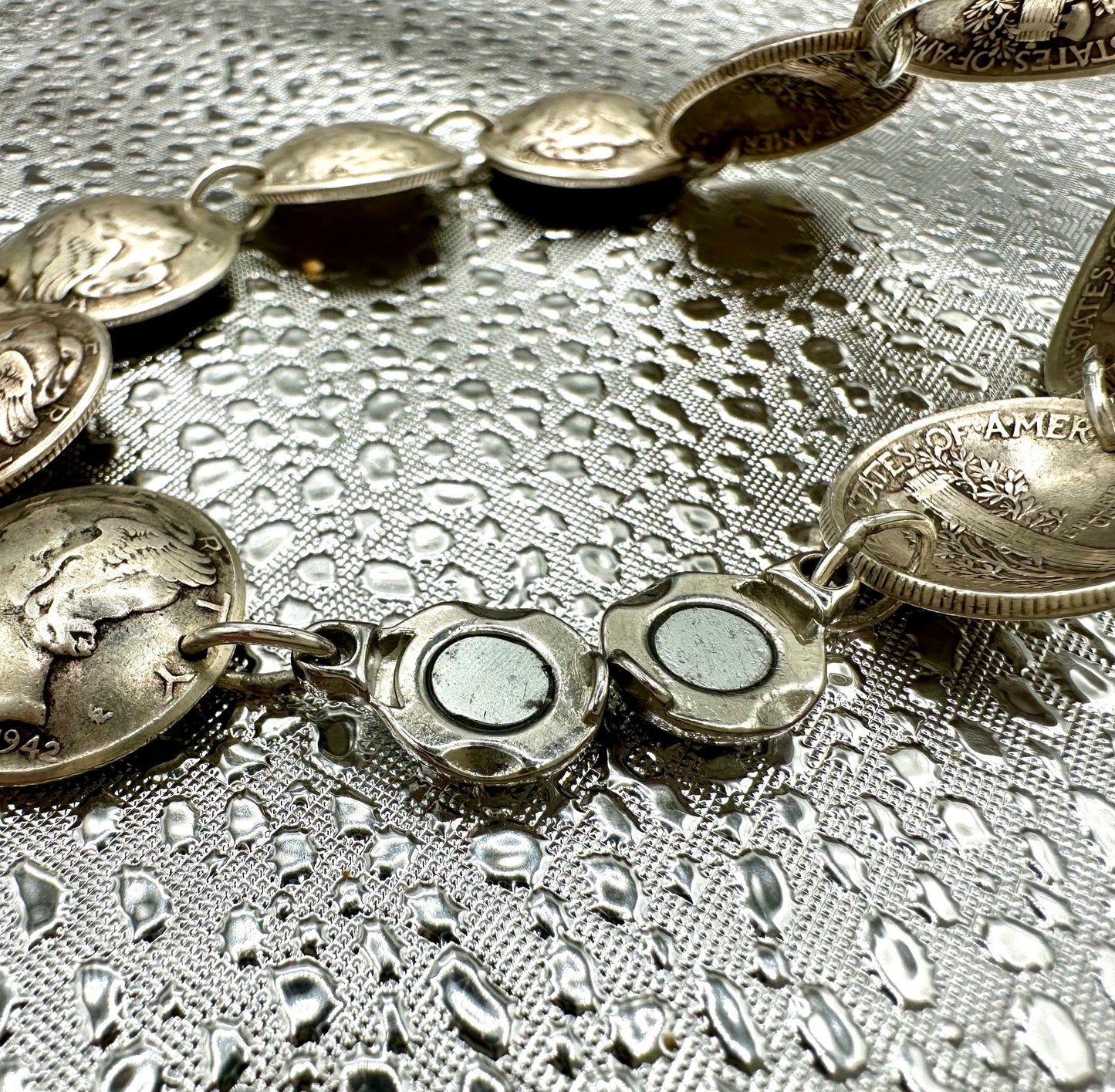 Mercury Silver Dime Coin Bracelet featuring magnetic clasp on a shiny texture metallic background.