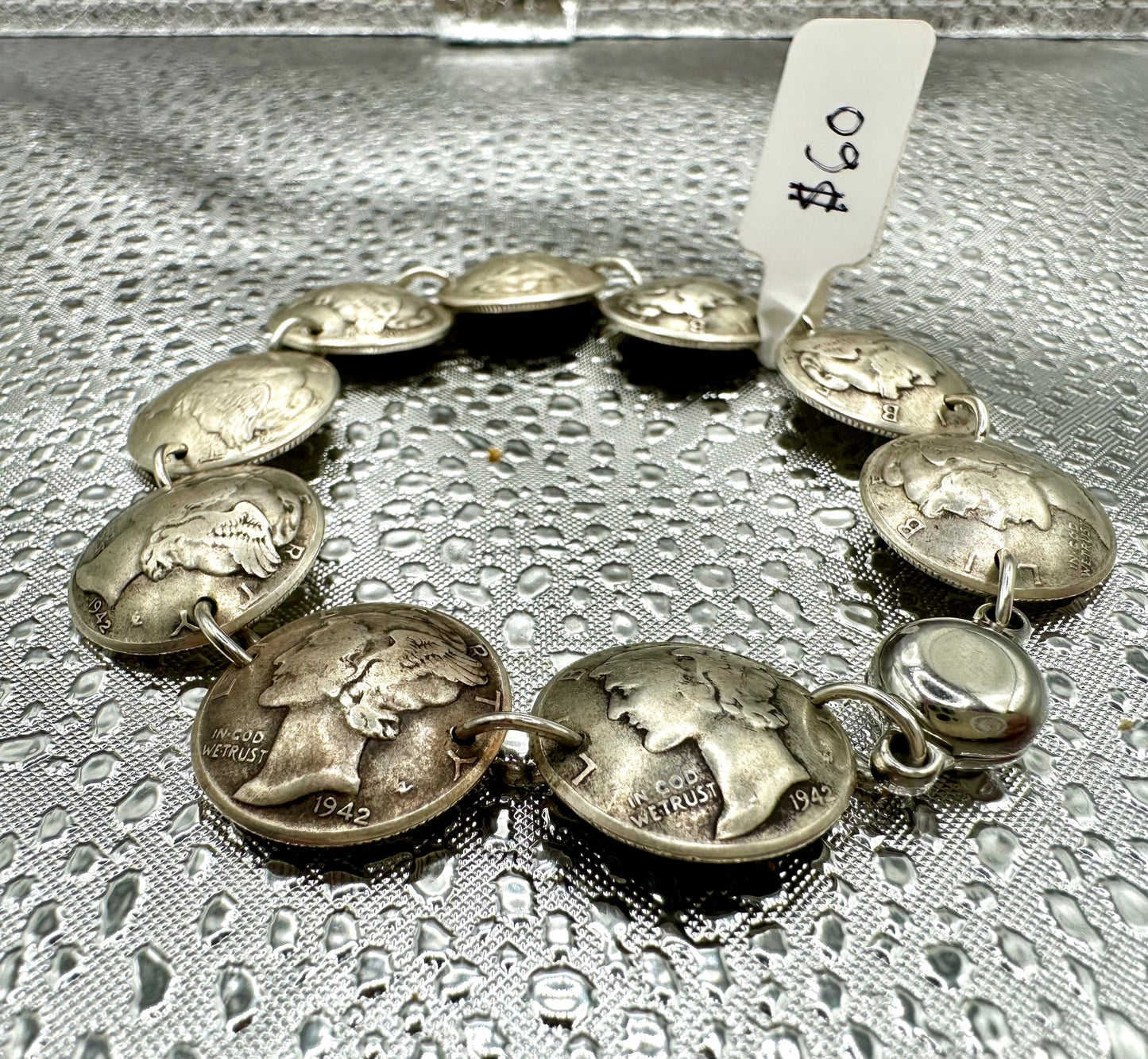 Mercury Silver Dime Coin Bracelet on a shiny texture metallic background.