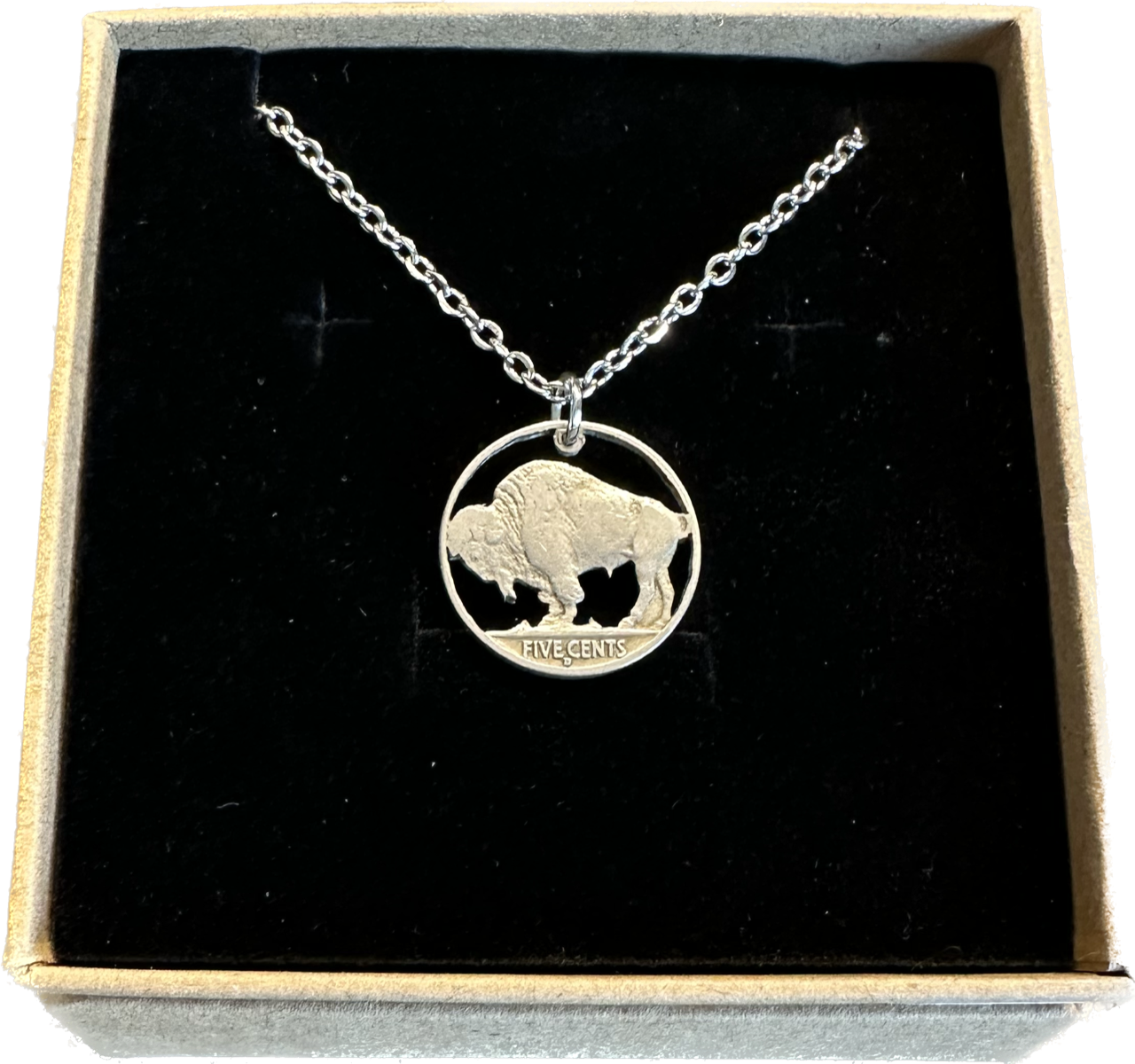 U.S. Buffalo Nickel (Reverse) Coin Necklace with a stainless chain in a brown kraft box on a black velvet background.