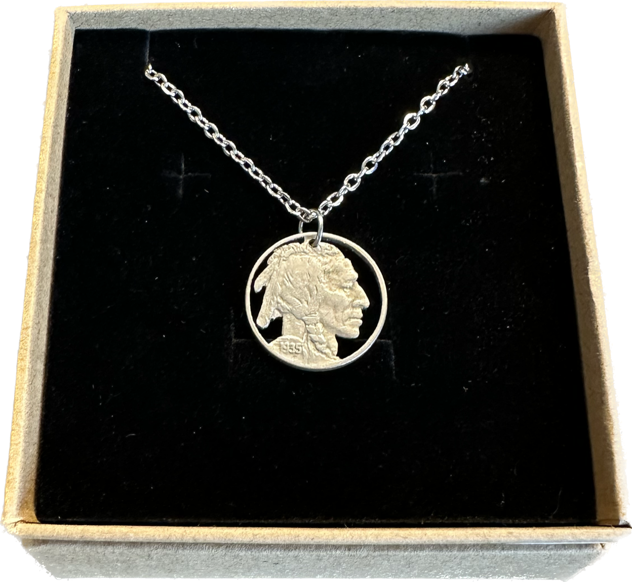 U.S. Buffalo Nickel (Front) Coin Necklace with a stainless chain in brown kraft box on black velvet background.