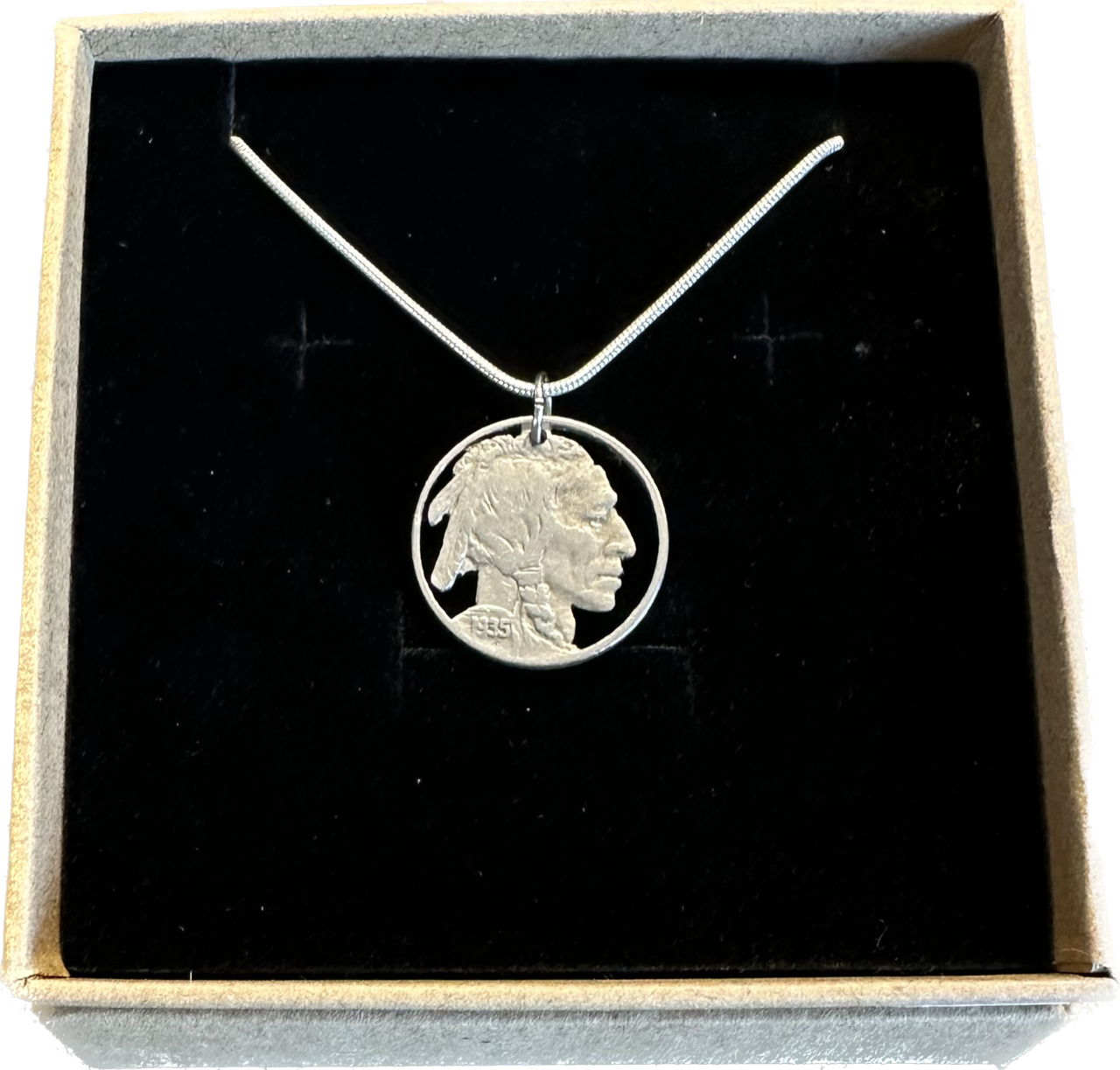 U.S. Buffalo Nickel (Front) Coin Necklace with a snake chain in brown kraft box on black velvet background.
