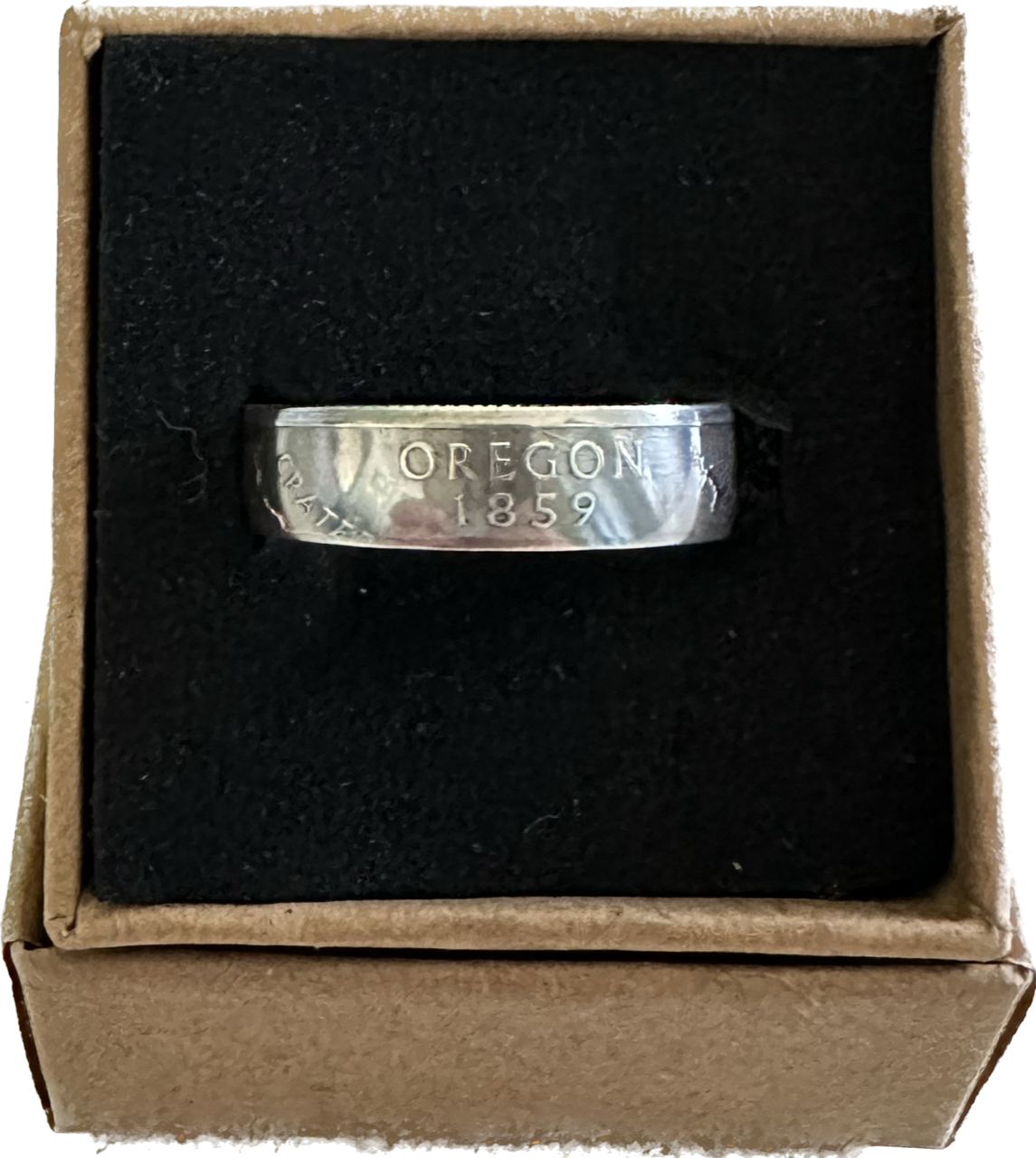 U.S. Silver State Quarter Coin Ring featuring Oregon in a brown kraft box on a black velvet background.
