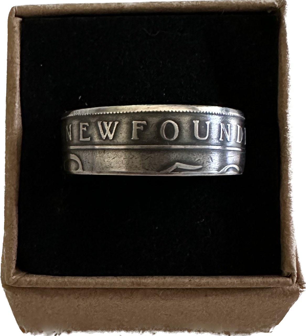 Newfoundland 50 Cents Silver Coin Ring in a brown kraft box on a black velvet background.