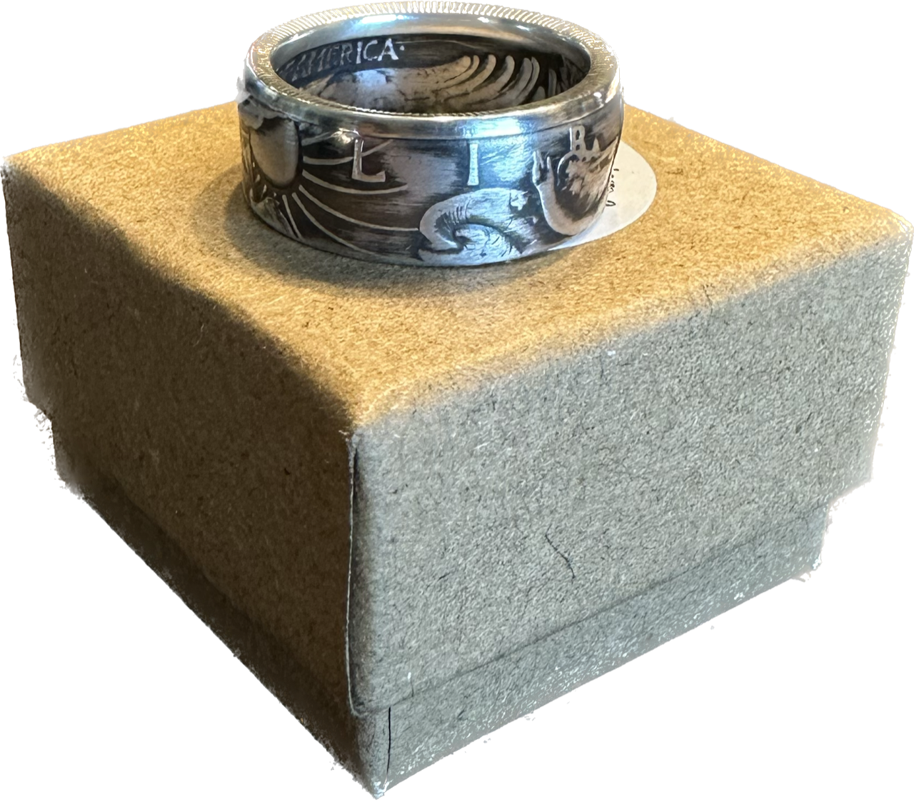 Walking Liberty Silver Half Dollar Coin Ring on a brown kraft box.