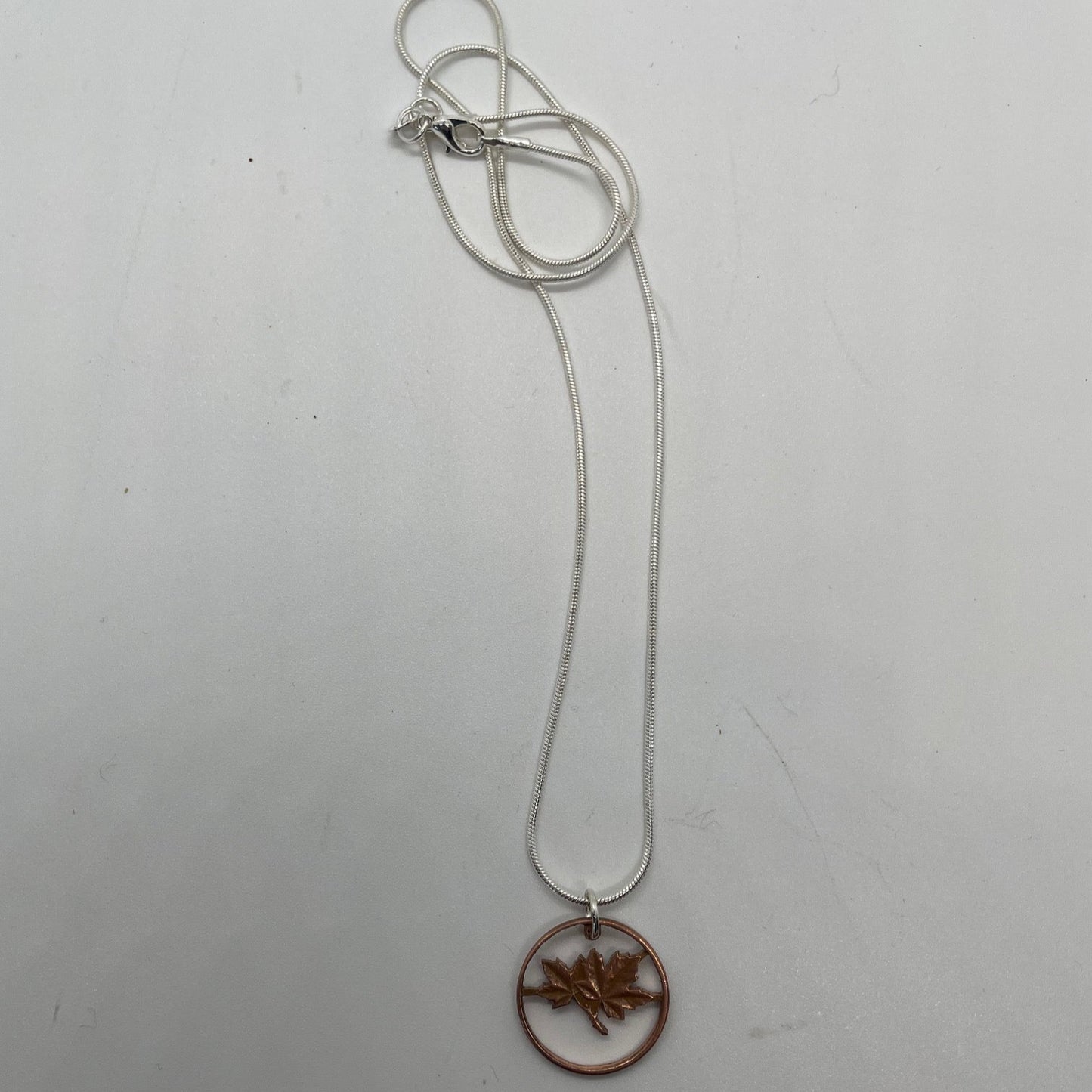Canada Maple Leaf Penny Hand Cut Coin Necklace on a white background. - Mountainstruck Coin Jewelry