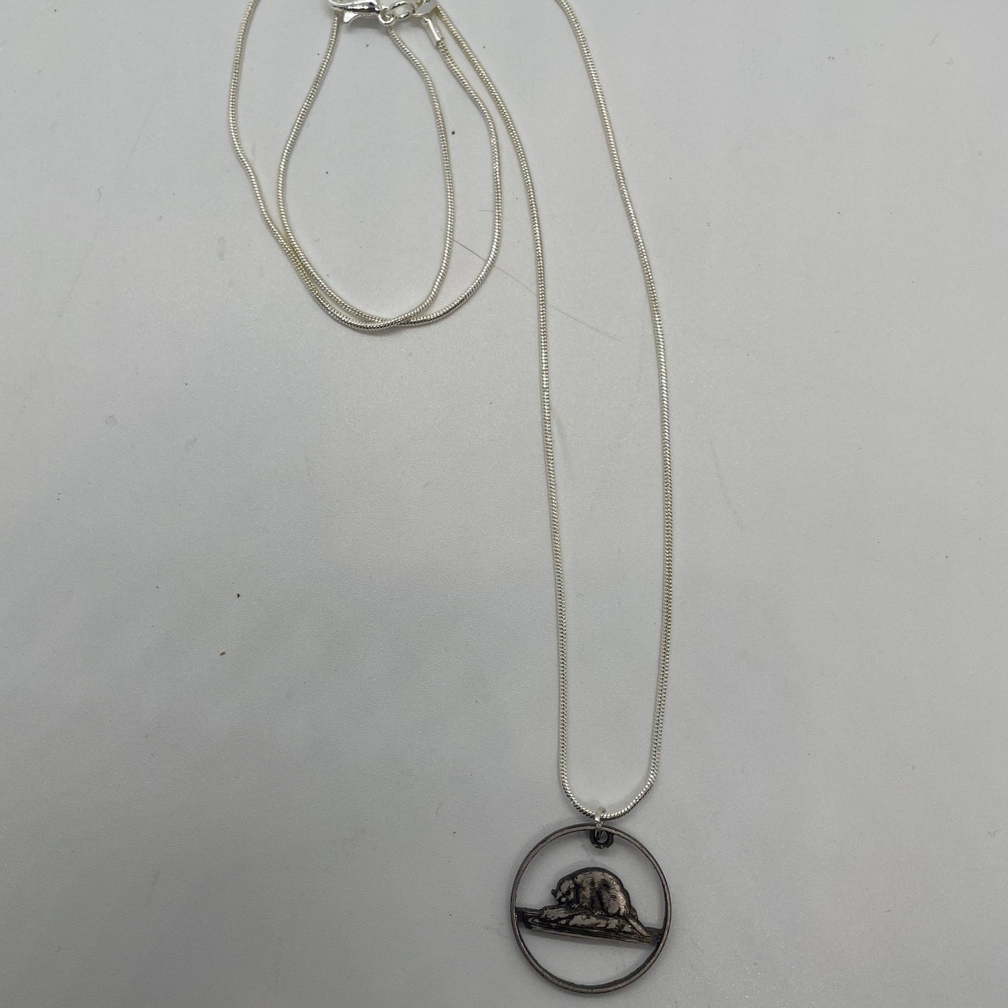 Canadian Nickel Beaver Hand Cut Coin Necklace with a white background. - Mountainstruck Coin Jewelry