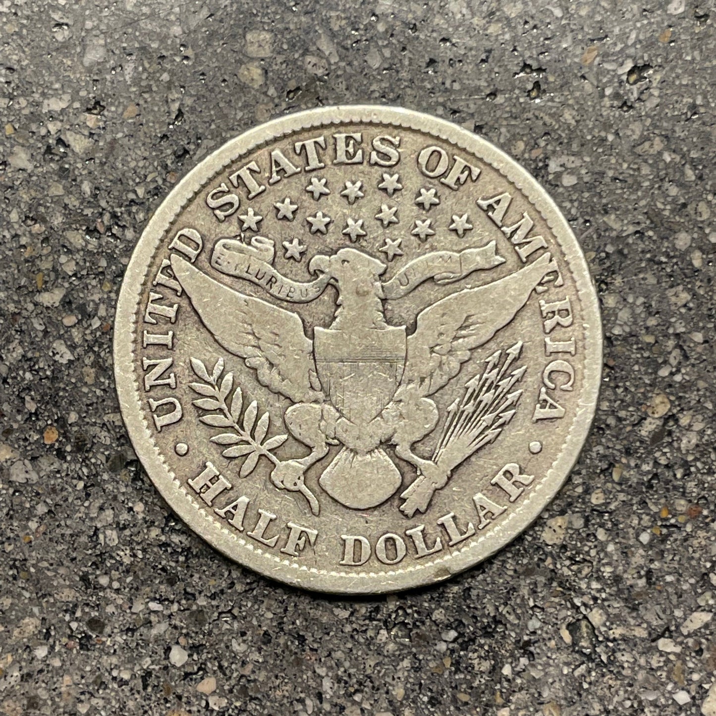 Barber Silver Half Dollar back of coin on a concrete background. - Mountainstruck Coin Jewelry