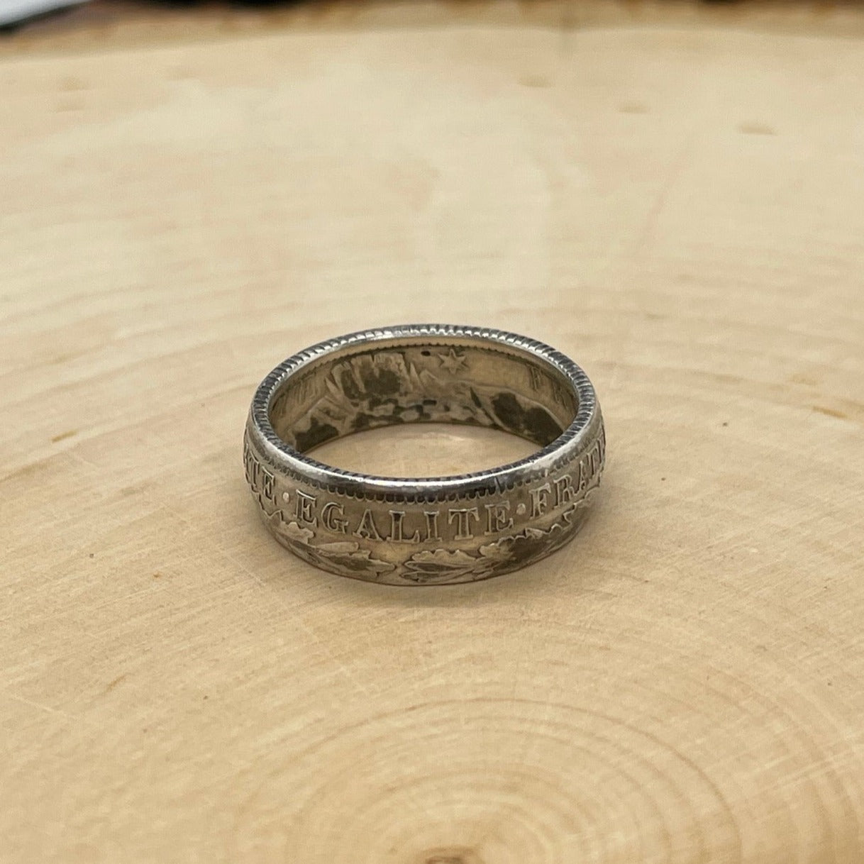 France 1 Franc Silver Coin Ring on a light wood round. - Mountainstruck Coin Jewelry