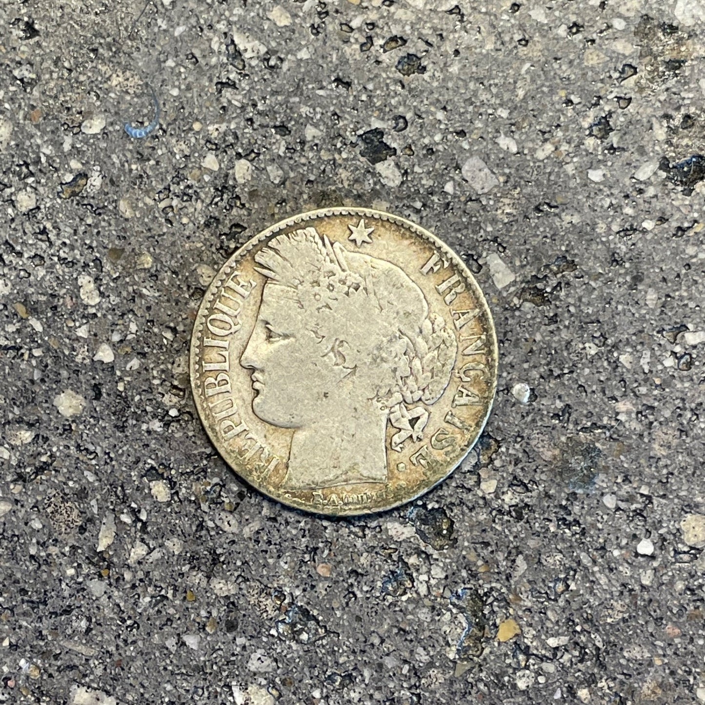 France 1 Franc Silver coin front on a concrete background. - Mountainstruck Coin Jewelry