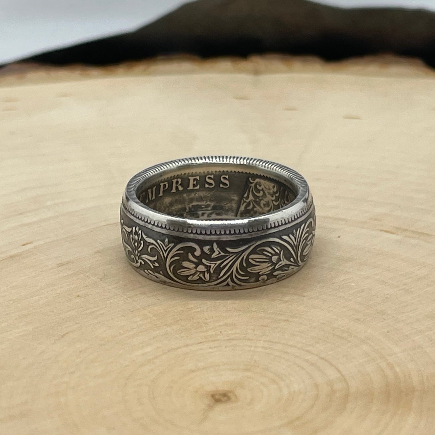 India 1 Rupee Silver Coin Ring (Rare, Victorian) on a light wood round. - Mountainstruck Coin Jewelry