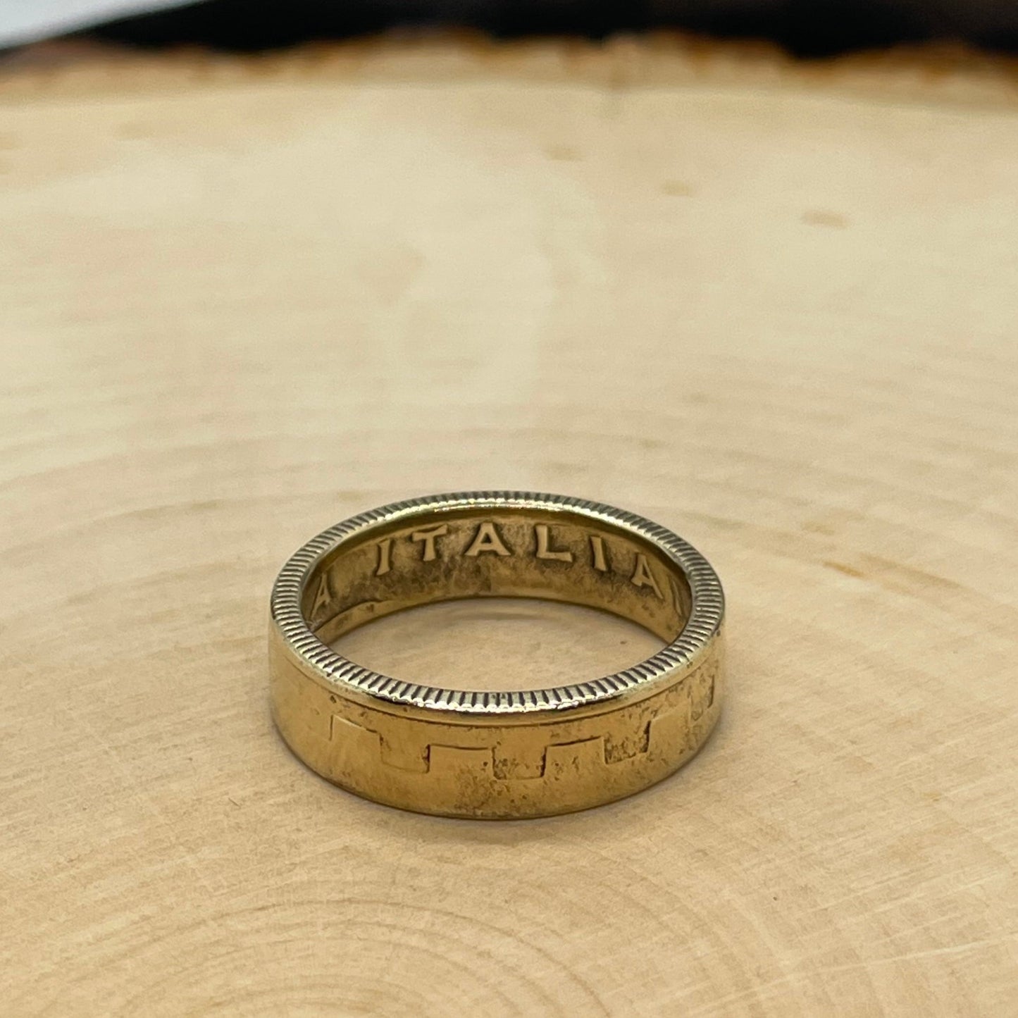Italy 200 Lire Coin Ring on a light wood round. - Mountainstruck Coin Jewelry