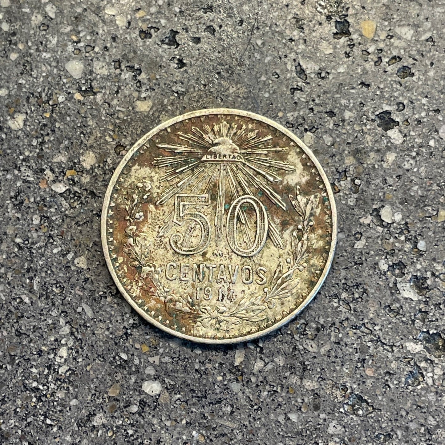 Mexico 50 Centavos Silver (Rare) Coin back on a concrete background. - Mountainstruck Coin Jewelry