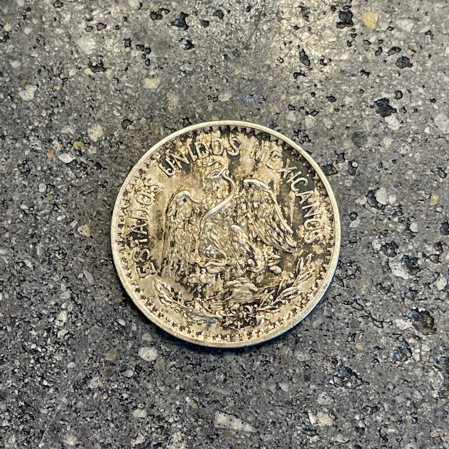 Mexico 50 Centavos Silver (Rare) Coin front on a concrete background. - Mountainstruck Coin Jewelry