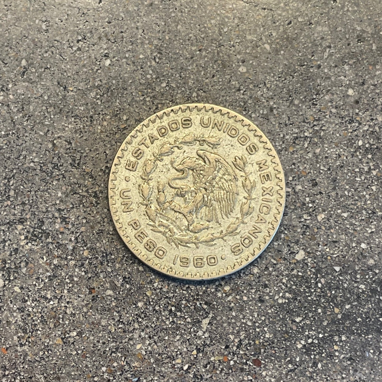 Mexico Silver Peso Coin back on a concrete background. - Mountainstruck Coin Jewelry