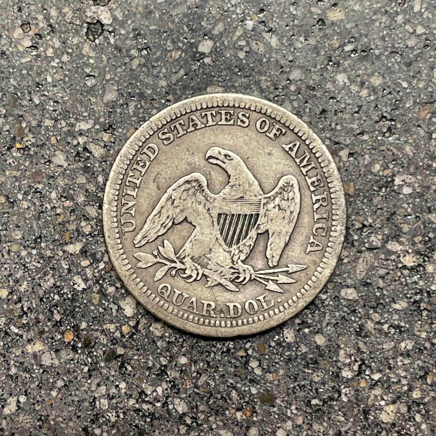 Seated Liberty Quarter Silver Coin back on a concrete background. - Mountainstruck Coin Jewelry