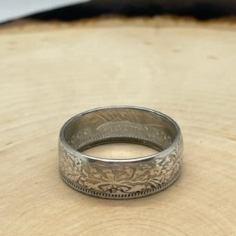 Swiss 2 Franc Silver Coin Ring (shine) on a light wood round. - Mountainstruck Coin Jewelry