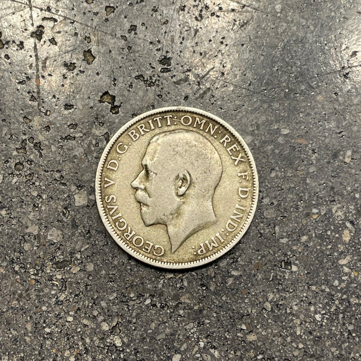 UK One Florin Silver Coin front on a concrete background. - Mountainstruck Coin Jewelry