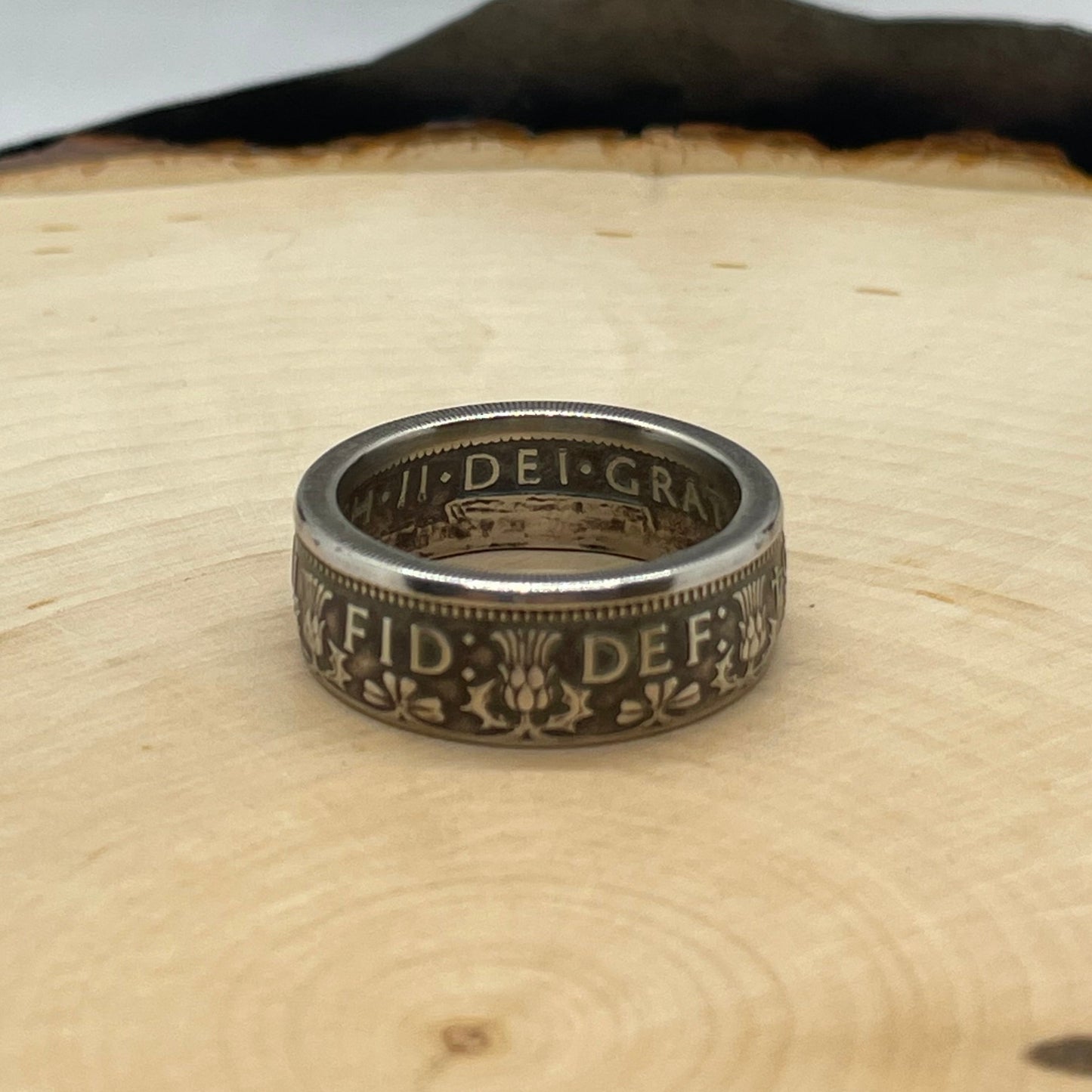 UK Two Shillings Coin Ring on a light wood round. - Mountainstruck Coin Jewelry