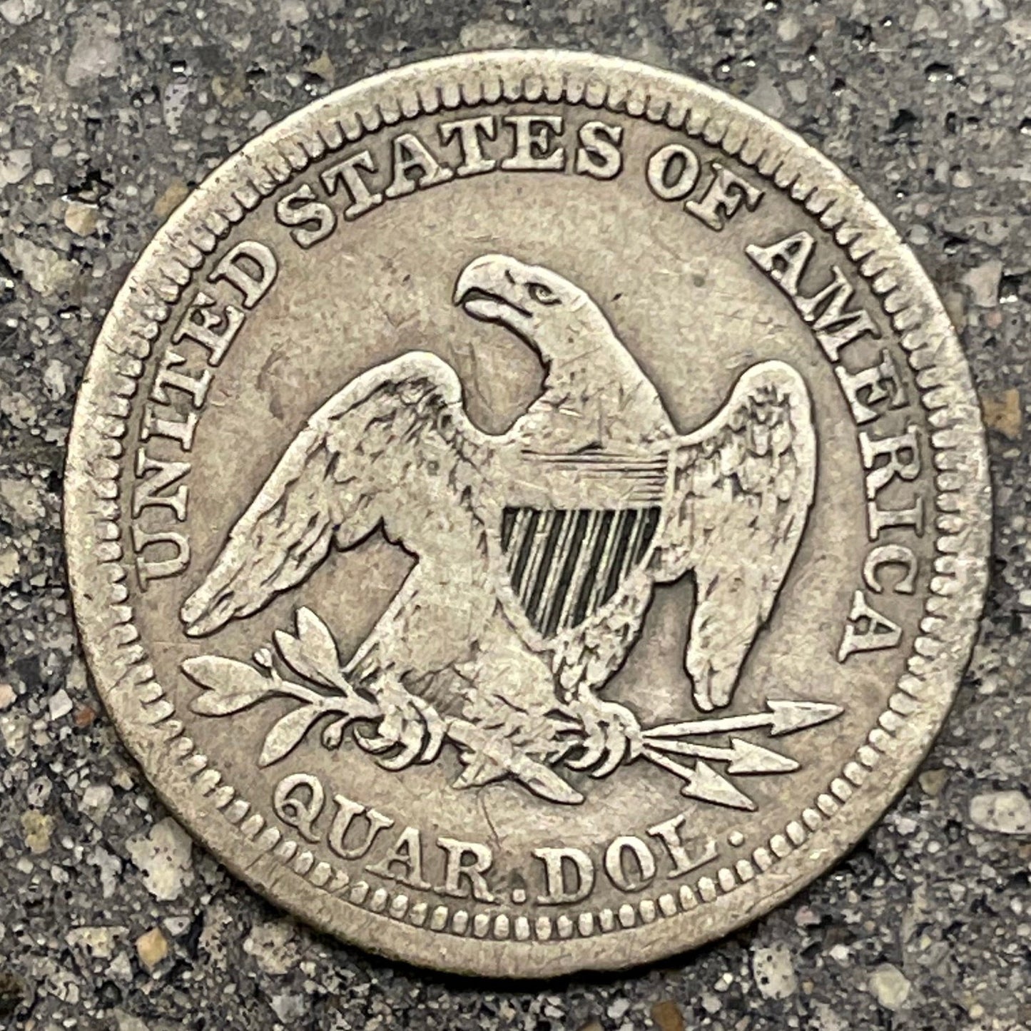 U.S. Seated Liberty Quarter Silver Coin back on a concrete background. - Mountainstruck Coin Jewelry