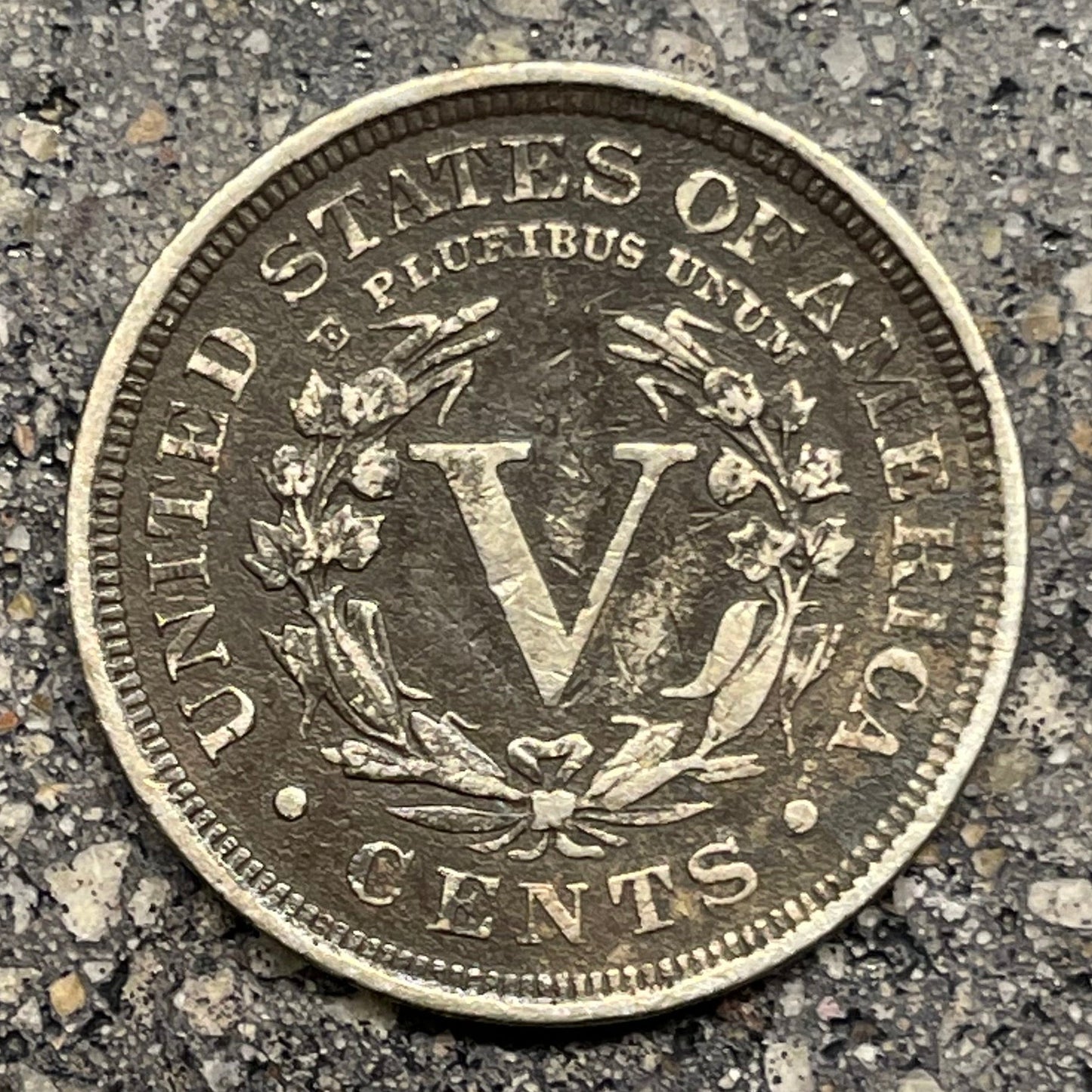 U.S. "V" Nickel coin backside on concrete background. - Mountainstruck Coin Jewelry