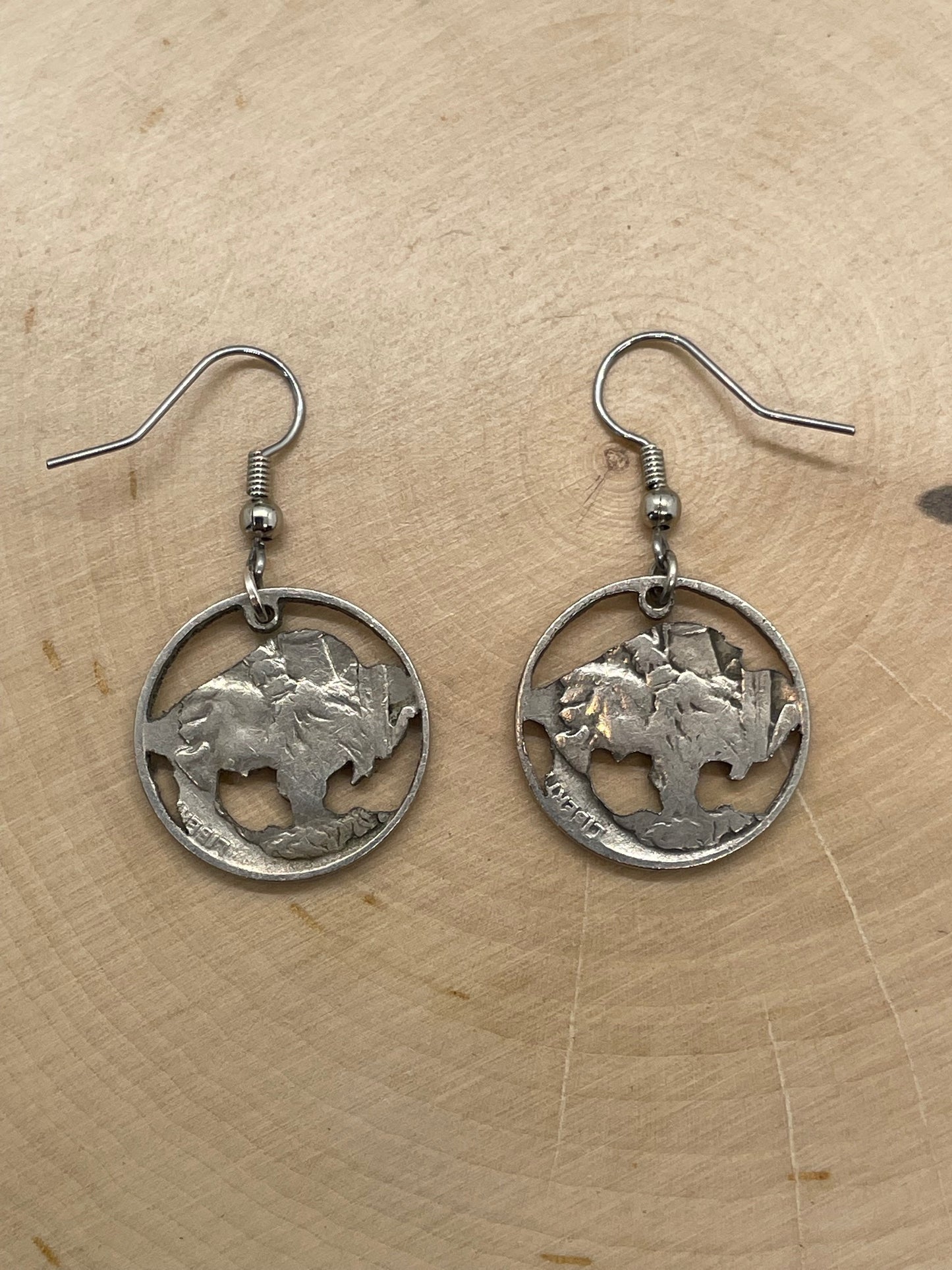 U.S. Buffalo Nickel Coin Earrings backside on a light wood round.
