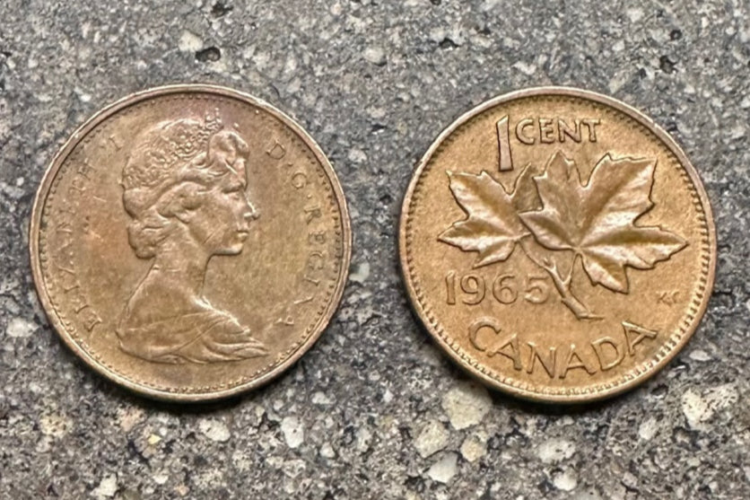 Canada Maple Leaf Penny on a concrete background. Front side of coin on the left and the back side of the coin on the right.