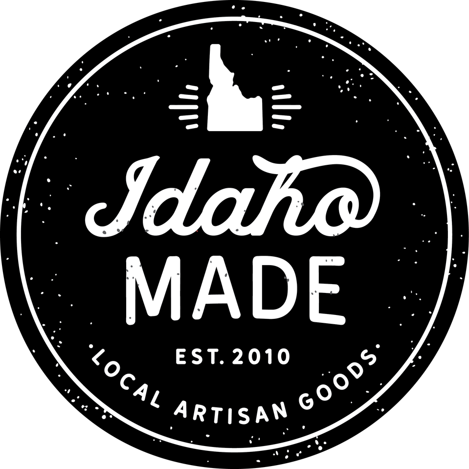 Round black and white Idaho Made logo with the state at the top of the logo and Idaho MADE text at the center. Below is additional text "est. 2010" and "LOCAL ARTISAN GOODS". - Mountainstruck Coin Jewelry