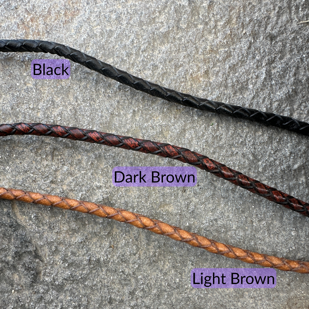 Bolo tie braided leather cord color options (black, Dark Brown, & Light Brown) on a textured rock background. - Mountainstruck Coin Jewelry