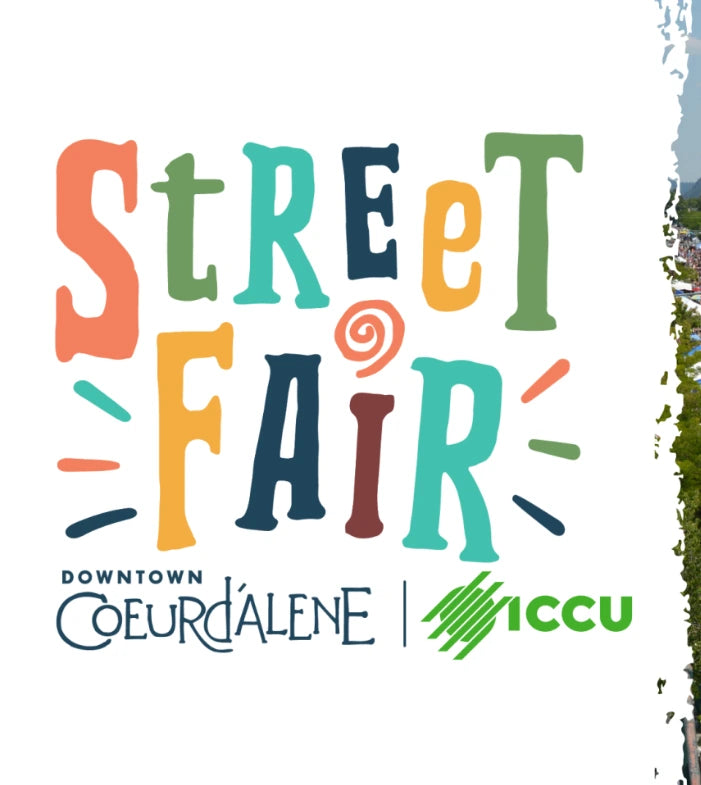Multicolored 'Street Fair' sign with 'Downtown Coeur d'Alene' and 'ICCU' logos on a white background. - Mountainstruck Coin Jewelry