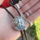 U.S. Walking Liberty Half Dollar Hand Cut Silver Coin Bolo Tie on a hand. - Mountainstruck Coin Jewelry